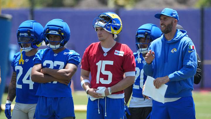 Jun 2, 2026; Woodland Hills, CA, USA; Los Angeles Rams running backs Blake Corum (24), Jarquez Hunter (27), quarterback Ty Simpson (15) and quarterbacks coach Dave Ragone watch during organized team activities at Rams Practice Facility. Mandatory Credit: Kirby Lee-Imagn Images Jun 2, 2026; Woodland Hills, CA, USA; Los Angeles Rams running backs Blake Corum (24), Jarquez Hunter (27), quarterback Ty Simpson (15) and quarterbacks coach Dave Ragone watch during organized team activities at Rams Practice Facility. Mandatory Credit: Kirby Lee-Imagn Images