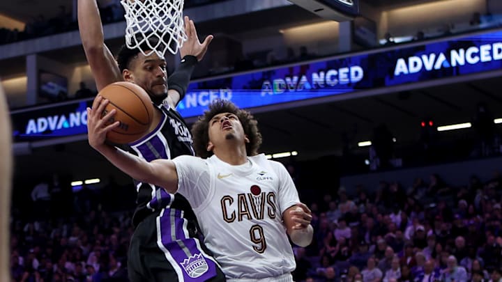 Feb 7, 2026; Sacramento, California, USA; Cleveland Cavaliers guard Craig Porter Jr. (9) goes up for a shot while being defended by Sacramento Kings center Dylan Cardwell (32) during the third quarter at Golden 1 Center. Mandatory Credit: Dennis Lee-Imagn Images