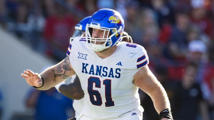 Nov 8, 2025; Tucson, Arizona, USA; Kansas Jayhawks offensive lineman Bryce Foster (61) against the Arizona Wildcats at Arizona Stadium. Mandatory Credit: Mark J. Rebilas-Imagn Images