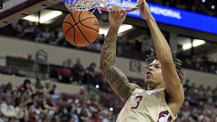 Mar 9, 2024; Tallahassee, Florida, USA; Florida State Seminoles forward Cam Corhen (3) dunks the basketball