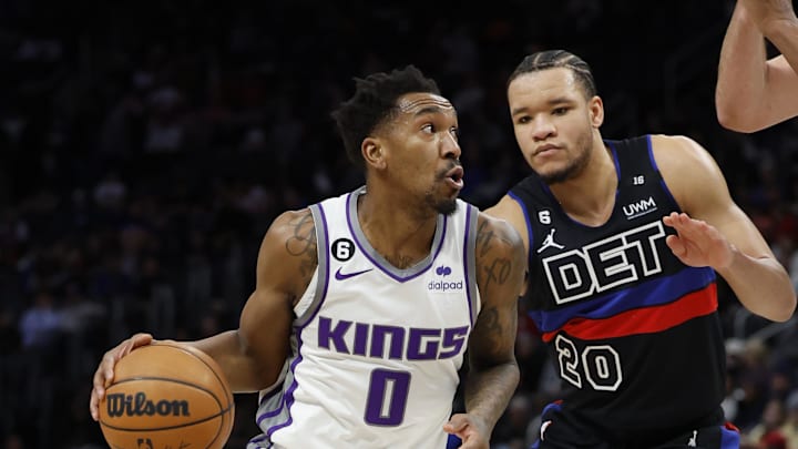 Dec 16, 2022; Detroit, Michigan, USA;  Sacramento Kings guard Malik Monk (0) dribbles defended by