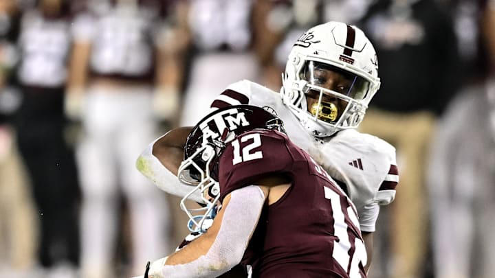 Nov 11, 2023; College Station, Texas, USA; Mississippi State Bulldogs running back Seth Davis (23) is tackled by Texas A&M Aggies linebacker Sam Mathews (12) during the fourth quarter at Kyle Field. Mandatory Credit: Maria Lysaker-Imagn Images