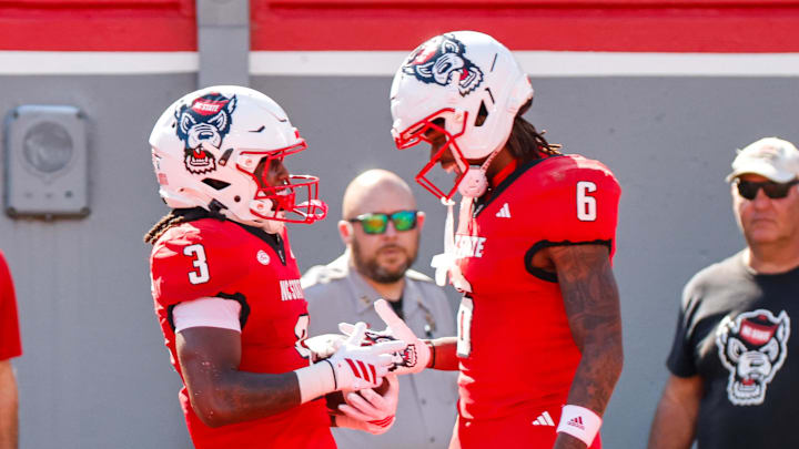 Oct 4, 2025; Raleigh, North Carolina, USA;  NC State Wolfpack running back Hollywood Smothers (3) and wide receiver Wesley Grimes (6) celebrate a touchdown during the first half of the game against Campbell Fighting Camels at Carter-Finley Stadium. Mandatory Credit: Jaylynn Nash-Imagn Images