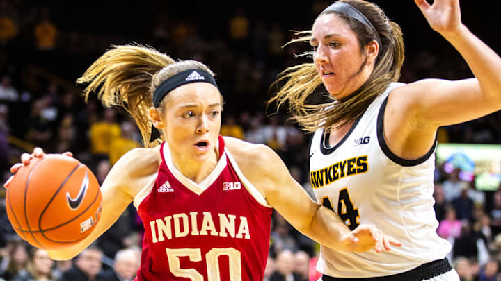 Indiana forward Brenna Wise (50) drives to the basket as Iowa's McKenna Warnock (14) defends during a NCAA Big Ten Conference women's basketball game, Sunday, Jan. 12, 2020, at Carver-Hawkeye Arena in Iowa City, Iowa.