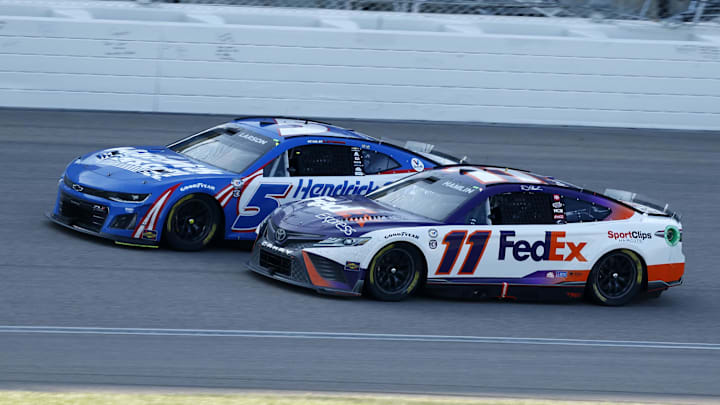 May 7, 2023; Denny Hamlin (11) battles Kyle Larson (5) during the 2023 AdventHealth 400 at Kansas Speedway. May 7, 2023; Denny Hamlin (11) battles Kyle Larson (5) during the 2023 AdventHealth 400 at Kansas Speedway.