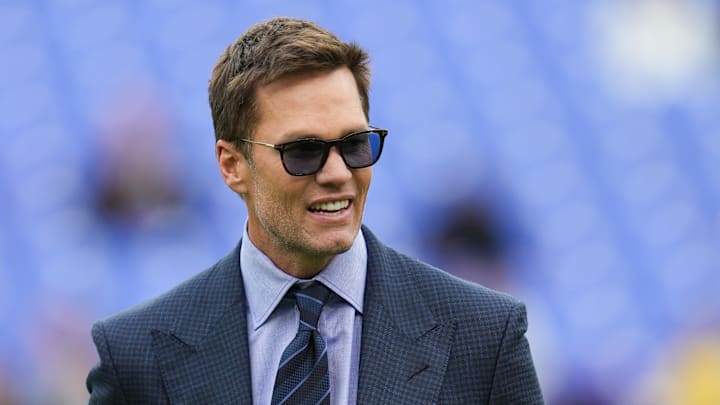 Oct 12, 2025; Baltimore, Maryland, USA; Fox Sports announcer Tom Brady looks on before the game between the Baltimore Ravens and the Los Angeles Rams at M&T Bank Stadium. Mandatory Credit: Mitch Stringer-Imagn Images