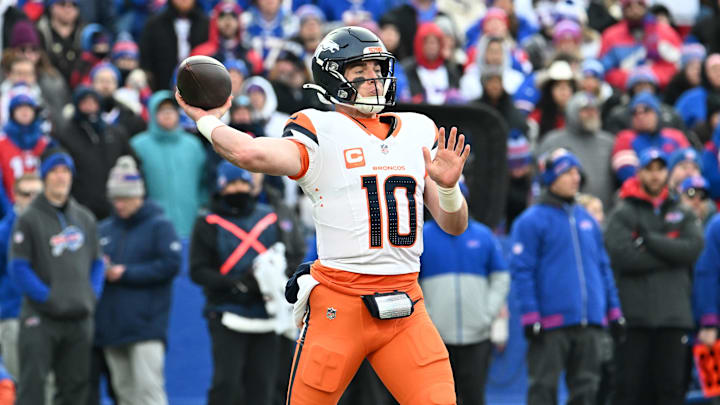 Jan 12, 2025; Orchard Park, New York, USA; Denver Broncos quarterback Bo Nix (10) throws downfield during the fourth quarter against the Buffalo Bills in an AFC wild card game at Highmark Stadium. 