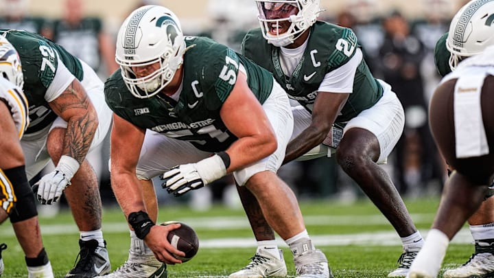 Michigan State quarterback Aidan Chiles (2) calls for a snap from offensive lineman Matt Gulbin (51) against Western Michigan during the first half at Spartan Stadium in East Lansing on Friday, August 29, 2025.