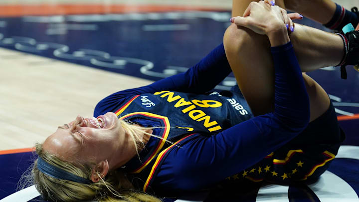 Aug 17, 2025; Uncasville, Connecticut, USA; Indiana Fever guard Sophie Cunningham (8) on the court injured as they take on the Connecticut Sun in the first half at Mohegan Sun Arena. Mandatory Credit: David Butler II-Imagn Images