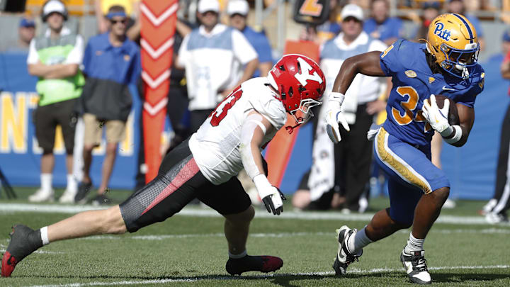 Sep 21, 2024; Pittsburgh, Pennsylvania, USA;  Pittsburgh Panthers running back Derrick Davis Jr. (34) runs the ball against the Youngstown State Penguins during the first quarter at Acrisure Stadium. Mandatory Credit: Charles LeClaire-Imagn Images