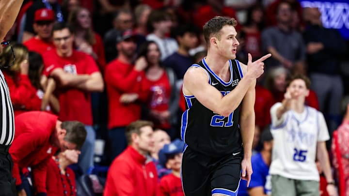 Feb 22, 2025; Tucson, Arizona, USA; BYU Cougars guard Trevin Knell (21) points after he makes a three-point basket during the second half against the Arizona Wildcats at McKale Center. Mandatory Credit: Aryanna Frank-Imagn Images
