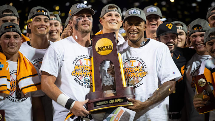 Tennessee's Blake Burke and Christian Moore hold the trophy after game three of the NCAA College World Series finals between Tennessee and Texas A&M at Charles Schwab Field in Omaha, Neb., on Monday, June 24, 2024.