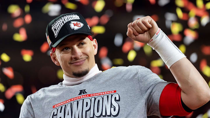 Confetti falls as Kansas City Chiefs quarterback Patrick Mahomes celebrates after defeating the Buffalo Bills during the AFC Championship game at GEHA Field at Arrowhead Stadium.
