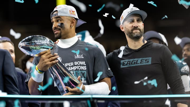 Feb 9, 2025; New Orleans, LA, USA; Philadelphia Eagles quarterback Jalen Hurts (left) and head coach Nick Sirianni celebrate with the Vince Lombardi Trophy after defeating the Kansas City Chiefs during Super Bowl LIX at Ceasars Superdome. Mandatory Credit: Mark J. Rebilas-Imagn Images