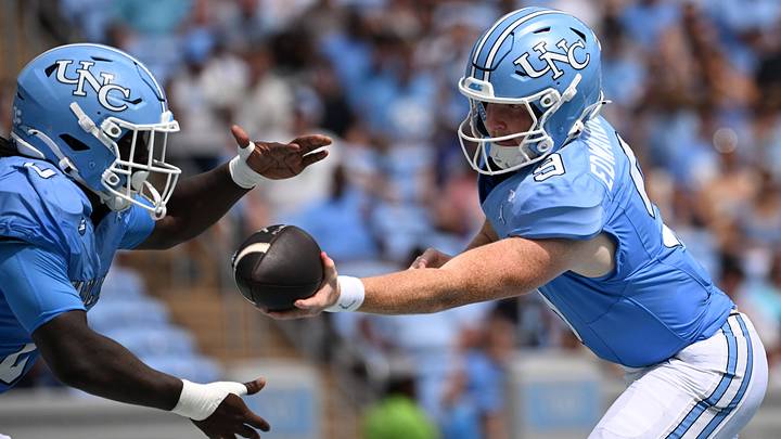 Sep 12, 2026; Chapel Hill, North Carolina, USA; North Carolina Tar Heels quarterback Billy Edwards Jr. (9) hands the ball off to running back Demon June (0) in the first quarter at Kenan Stadium. Mandatory Credit: Bob Donnan-Imagn Images Sep 12, 2026; Chapel Hill, North Carolina, USA; North Carolina Tar Heels quarterback Billy Edwards Jr. (9) hands the ball off to running back Demon June (0) in the first quarter at Kenan Stadium. Mandatory Credit: Bob Donnan-Imagn Images