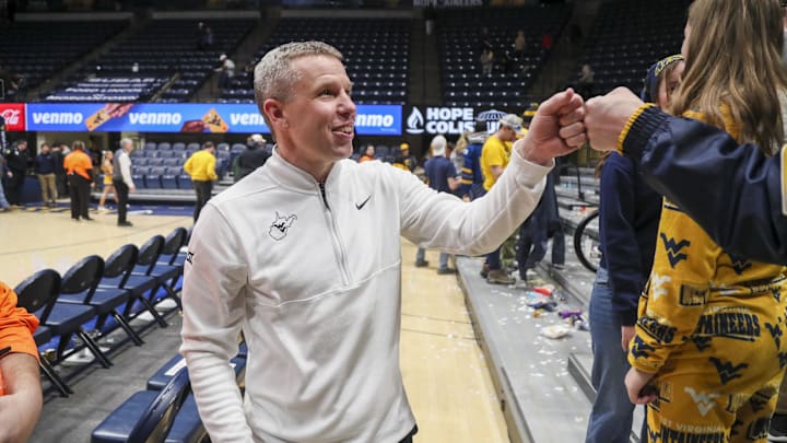 Jan 27, 2026; Morgantown, West Virginia, USA; West Virginia Mountaineers head coach Ross Hodge celebrates with fans after defeating the Kansas State Wildcats at Hope Coliseum. Mandatory Credit: Ben Queen-Imagn Imagesa Jan 27, 2026; Morgantown, West Virginia, USA; West Virginia Mountaineers head coach Ross Hodge celebrates with fans after defeating the Kansas State Wildcats at Hope Coliseum. Mandatory Credit: Ben Queen-Imagn Imagesa