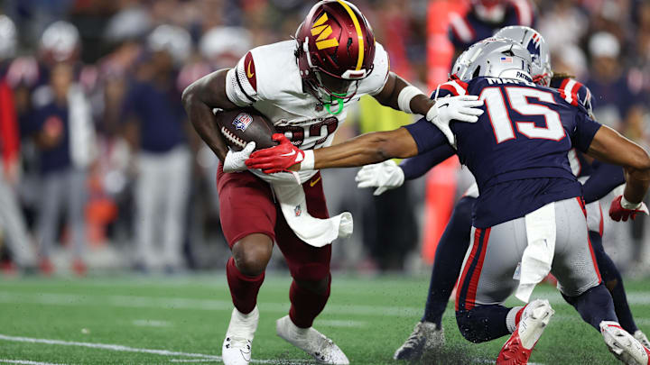 Aug 8, 2025; Foxborough, Massachusetts, USA; Washington Commanders running back Jacory Croskey-Merritt (32) runs the ball during the first half against the New England Patriots at Gillette Stadium. 