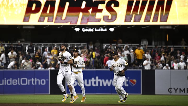 San Diego Padres right fielder Fernando Tatis Jr. (23), left fielder Jose Azocar (28) and center fielder Trent Grisham (1) run off the field after defeating the Philadelphia Phillies at Petco Park on Sept. 5, 2023.