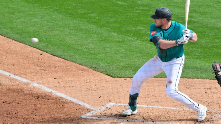 Feb 20, 2026; Peoria, Arizona, USA; Seattle Mariners right fielder Luke Raley (20) at bat in the third inning against the San Diego Padres during a Spring Training game at Peoria Sports Complex. Mandatory Credit: Matt Kartozian-Imagn Images