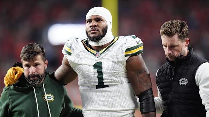 Dec 14, 2025; Denver, Colorado, USA; Green Bay Packers defensive end Micah Parsons (1) walks off the field with help from medical personnel following an injury during the third quarter against the Denver Broncos at Empower Field at Mile High. Mandatory Credit: Ron Chenoy-Imagn Images Dec 14, 2025; Denver, Colorado, USA; Green Bay Packers defensive end Micah Parsons (1) walks off the field with help from medical personnel following an injury during the third quarter against the Denver Broncos at Empower Field at Mile High. Mandatory Credit: Ron Chenoy-Imagn Images