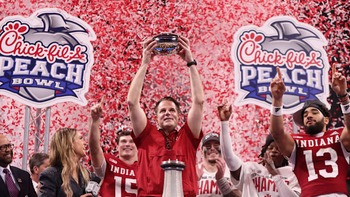 Jan 9, 2026; Atlanta, GA, USA; Indiana Hoosiers head coach Curt Cignetti raises the trophy after the 2025 Peach Bowl and semifinal game of the College Football Playoff at Mercedes-Benz Stadium. Mandatory Credit: Brett Davis-Imagn Images