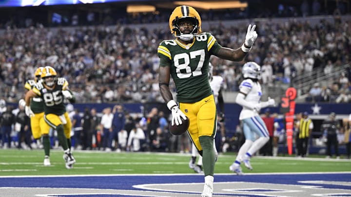 Green Bay Packers wide receiver Romeo Doubs (87) celebrates after scoring a touchdown against the Dallas Cowboys in the fourth quarter at AT&T Stadium. 