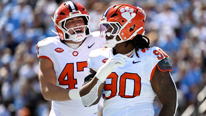 Oct 4, 2025; Chapel Hill, North Carolina, USA; Clemson Tigers defensive tackle Stephiylan Green (90) reacts with linebacker Sammy Brown (47) in the second quarter at Kenan Stadium. Mandatory Credit: Bob Donnan-Imagn Images Oct 4, 2025; Chapel Hill, North Carolina, USA; Clemson Tigers defensive tackle Stephiylan Green (90) reacts with linebacker Sammy Brown (47) in the second quarter at Kenan Stadium. Mandatory Credit: Bob Donnan-Imagn Images
