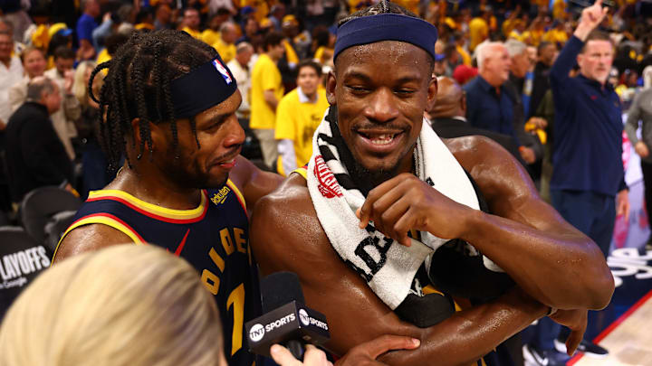 Apr 28, 2025; San Francisco, California, USA; Golden State Warriors guard Buddy Hield (7) celebrates with forward Jimmy Butler III (10) as he speaks to TNT after the game four of the 2025 NBA Playoffs first round against the Houston Rockets at Chase Center. Mandatory Credit: Kelley L Cox-Imagn Images