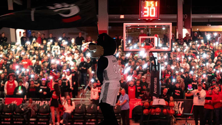 Cincinnati Bearcats mascot waives a flag in before the NCAA basketball game between the Cincinnati Bearcats and Arizona State Sun Devils at the Fifth Third Arena in Cincinnati on Saturday, January 18, 2025.