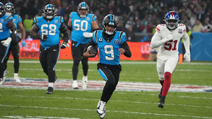 Nov 10, 2024; Munich, Germany; Carolina Panthers quarterback Bryce Young (9) is pursued by New York Giants linebacker Azeez Ojulari (51) on a 24-yard run n the second half during the 2024 NFL Munich Game at Allianz Arena. Mandatory Credit: Kirby Lee-Imagn Images Nov 10, 2024; Munich, Germany; Carolina Panthers quarterback Bryce Young (9) is pursued by New York Giants linebacker Azeez Ojulari (51) on a 24-yard run n the second half during the 2024 NFL Munich Game at Allianz Arena. Mandatory Credit: Kirby Lee-Imagn Images