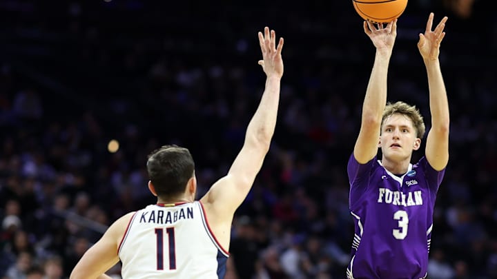 Mar 20, 2026; Philadelphia, PA, USA; Furman Paladins guard Asa Thomas (3) shoots the ball against UConn Huskies forward Alex Karaban (11) in the second half during a first round game of the men's 2026 NCAA Tournament at Xfinity Mobile Arena. Mandatory Credit: Bill Streicher-Imagn Images Mar 20, 2026; Philadelphia, PA, USA; Furman Paladins guard Asa Thomas (3) shoots the ball against UConn Huskies forward Alex Karaban (11) in the second half during a first round game of the men's 2026 NCAA Tournament at Xfinity Mobile Arena. Mandatory Credit: Bill Streicher-Imagn Images