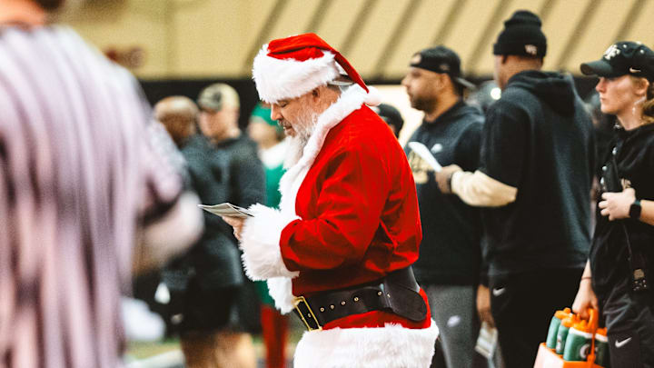 Wake Forest Football defensive coordinator Scottie Hazelton dressed as Santa Claus at practice.