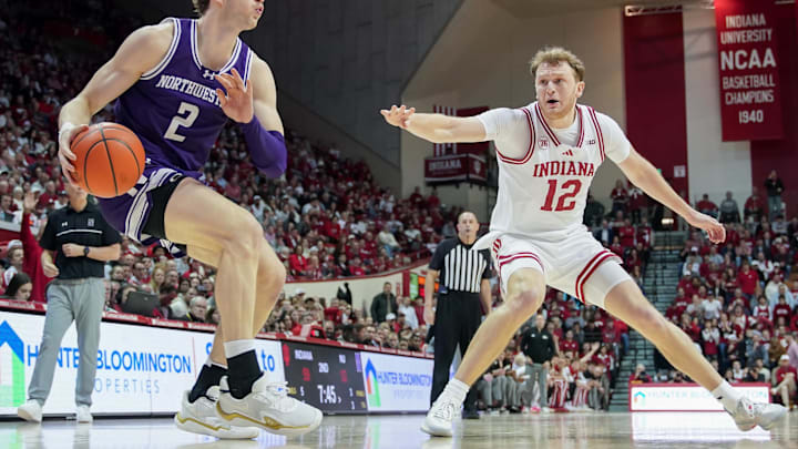Feb 24, 2026; Bloomington, Indiana, USA; Northwestern Wildcats forward Nick Martinelli (2) dribbles against Indiana Hoosiers forward Tucker DeVries (12) during the second half at Simon Skjodt Assembly Hall. Mandatory Credit: Robert Goddin-Imagn Images Feb 24, 2026; Bloomington, Indiana, USA; Northwestern Wildcats forward Nick Martinelli (2) dribbles against Indiana Hoosiers forward Tucker DeVries (12) during the second half at Simon Skjodt Assembly Hall. Mandatory Credit: Robert Goddin-Imagn Images