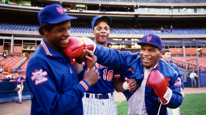 1990; Flushing, NY, USA; FILE PHOTO; New York Mets pitcher Dwight Gooden and right fielder Darryl Strawberry (18) joke around on the field with boxer Mike Tyson