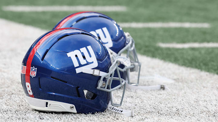 Aug 16, 2025; East Rutherford, New Jersey, USA; New York Giants helmets rest on the field before the preseason game against the New York Jets at MetLife Stadium. Mandatory Credit: Vincent Carchietta-Imagn Images