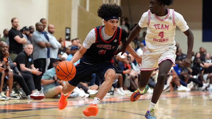 Florida Rebels Cayden Daughtry (3) moves towards the basket as Team Herro Takis Tyler (4) defends during the Florida Rebels and Team Herro semifinal basketball game at the 2026 Nike Peach Jam in North Augusta, S.C., on Saturday, July 18, 2026. The Florida Rebels won 84-76 and advance to the championship tomorrow.