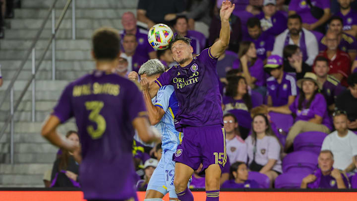 Oct 19, 2024; Orlando, Florida, USA; Orlando City defender Rodrigo Schlegel (15) heads the ball during the second half against the Atlanta United at Inter&Co Stadium. Mandatory Credit: Mike Watters-Imagn Images