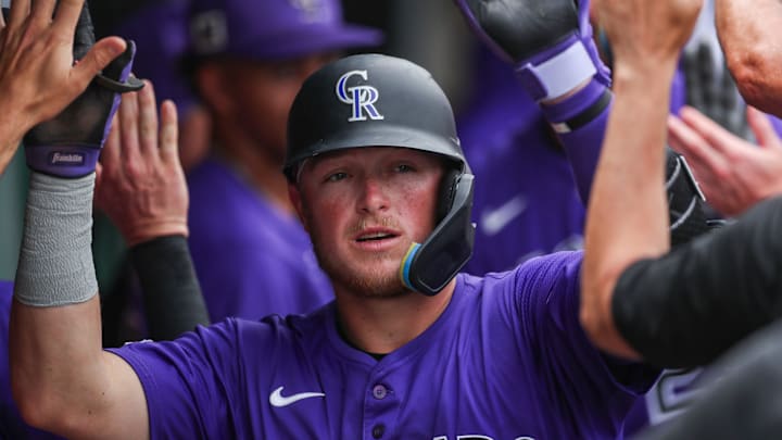 Colorado Rockies catcher Hunter Goodman (15) celebrates in the dugout after a two run home run during a spring training game against the Minnesota Twins at Lee Health Sports Complex in Fort Myers, FL.