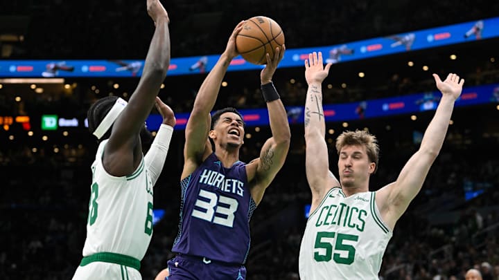 Apr 11, 2025; Boston, Massachusetts, USA; Charlotte Hornets guard Jaylen Sims (33) shoots against Boston Celtics center Neemias Queta (88) and forward Baylor Scheierman (55) during the second half at TD Garden. Mandatory Credit: Eric Canha-Imagn Images Apr 11, 2025; Boston, Massachusetts, USA; Charlotte Hornets guard Jaylen Sims (33) shoots against Boston Celtics center Neemias Queta (88) and forward Baylor Scheierman (55) during the second half at TD Garden. Mandatory Credit: Eric Canha-Imagn Images