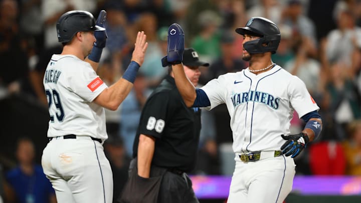 Sep 13, 2025; Seattle, Washington, USA; Seattle Mariners catcher Cal Raleigh (29) and center fielder Julio Rodriguez (44) celebrate after both scored a run against the Los Angeles Angels during the fifth inning at T-Mobile Park. Mandatory Credit: Steven Bisig-Imagn Images Sep 13, 2025; Seattle, Washington, USA; Seattle Mariners catcher Cal Raleigh (29) and center fielder Julio Rodriguez (44) celebrate after both scored a run against the Los Angeles Angels during the fifth inning at T-Mobile Park. Mandatory Credit: Steven Bisig-Imagn Images