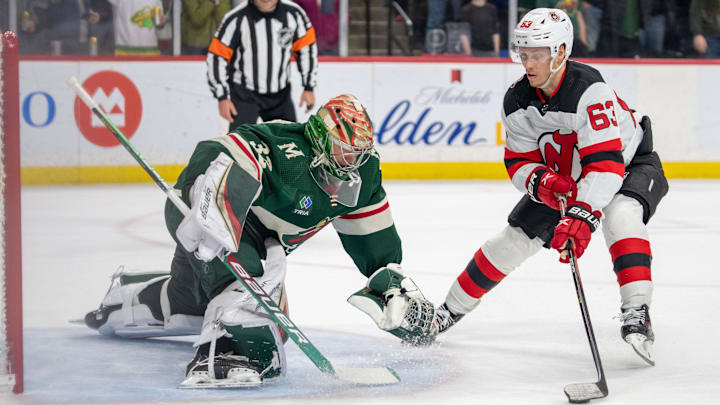 Feb 11, 2023; Saint Paul, Minnesota, USA; Minnesota Wild goaltender Filip Gustavsson (32) makes a save against New Jersey Devils left wing Jesper Bratt (63) in shootouts at Xcel Energy Center. Mandatory Credit: Matt Blewett-Imagn Images