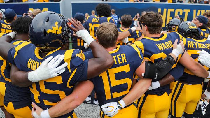 Sep 12, 2026; Morgantown, West Virginia, USA; West Virginia Mountaineers players celebrate after defeating the UT Martin Skyhawks at Milan Puskar Stadium. Mandatory Credit: Ben Queen-Imagn Images Sep 12, 2026; Morgantown, West Virginia, USA; West Virginia Mountaineers players celebrate after defeating the UT Martin Skyhawks at Milan Puskar Stadium. Mandatory Credit: Ben Queen-Imagn Images
