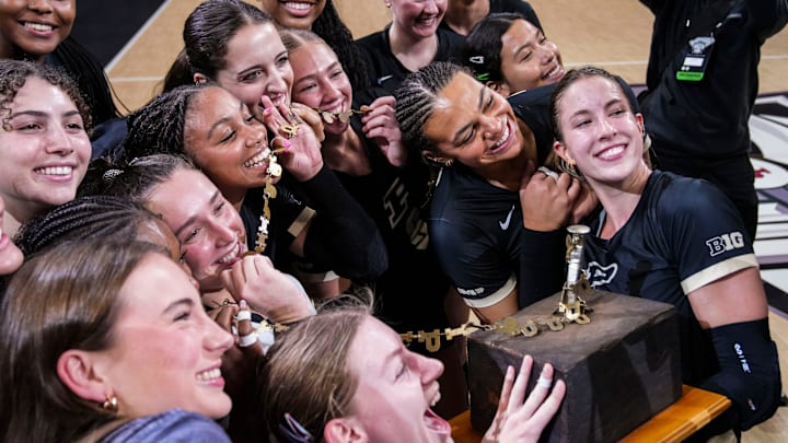 The Purdue Boilermakers pose with the trophy The Purdue Boilermakers pose with the trophy