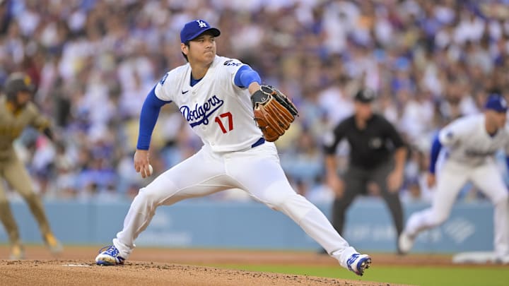 Jun 16, 2025; Los Angeles, California, USA; Los Angeles Dodgers designated hitter Shohei Ohtani (17) throws against the San Diego Padres during the first inning at Dodger Stadium. Mandatory Credit: Jayne Kamin-Oncea-Imagn Images