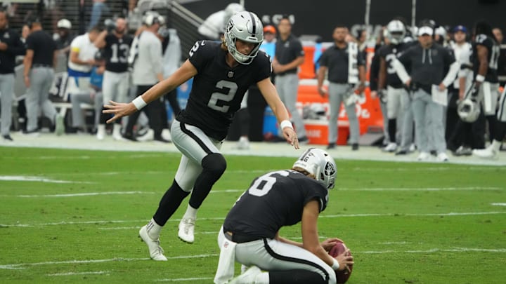 Sep 18, 2022; Paradise, Nevada, USA; Las Vegas Raiders place kicker Daniel Carlson (2) kicks a field goal out of the hold of punter AJ Cole (6) in the first half against the Arizona Cardinals at Allegiant Stadium. Mandatory Credit: Kirby Lee-Imagn Images Sep 18, 2022; Paradise, Nevada, USA; Las Vegas Raiders place kicker Daniel Carlson (2) kicks a field goal out of the hold of punter AJ Cole (6) in the first half against the Arizona Cardinals at Allegiant Stadium. Mandatory Credit: Kirby Lee-Imagn Images