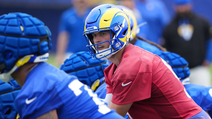 May 28, 2025; Woodland Hills, CA, USA; Los Angeles Rams quarterback Matthew Stafford (9) prepares to take the snap during organized team activities at Rams Practice Facility. Mandatory Credit: Kirby Lee-Imagn Images