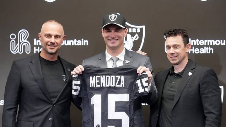 Apr 24, 2026; Henderson, NV, USA; Las Vegas Raiders quarterback Fernando Mendoza (center) poses with jersey with general manager John Spytek (left) and head coach Klint Kubiak  at introductory press conference at Intermountain Health Performance Center after being selected as the No. 1 pick in the 2026 NFL Draft. Mandatory Credit: Kirby Lee-Imagn Images