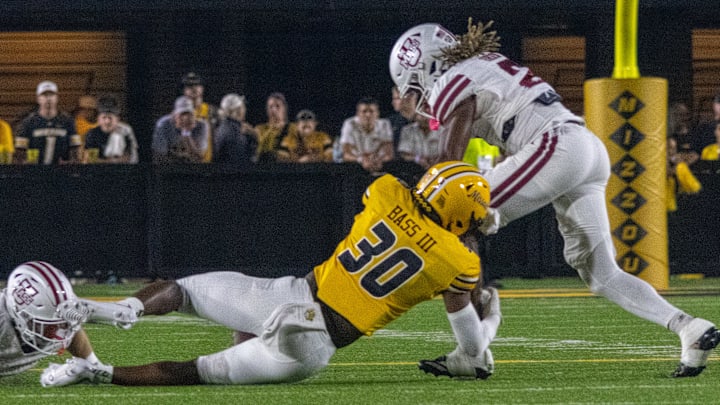 Sept 27, 2025; Columbia, Missouri, USA; Missouri Tigers safety CJ Bass (30) tackles a Minuteman in a game against UMass at Faurot Field at Memorial Stadium. Sept 27, 2025; Columbia, Missouri, USA; Missouri Tigers safety CJ Bass (30) tackles a Minuteman in a game against UMass at Faurot Field at Memorial Stadium.