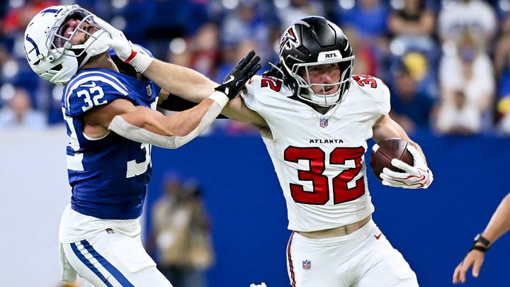 Aug 22, 2026; Indianapolis, Indiana, USA; Atlanta Falcons running back Cash Jones (32) stiff arms Indianapolis Colts safety Daniel Scott (32) during the second half at Lucas Oil Stadium. Mandatory Credit: Robert Goddin-Imagn Images