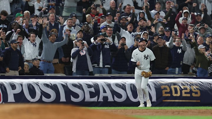 Oct 2, 2025; Bronx, New York, USA; New York Yankees third baseman Ryan McMahon (19) reacts after catching the final out of the game against the Boston Red Sox during game three of the Wildcard round for the 2025 MLB playoffs at Yankee Stadium. Mandatory Credit: Vincent Carchietta-Imagn Images